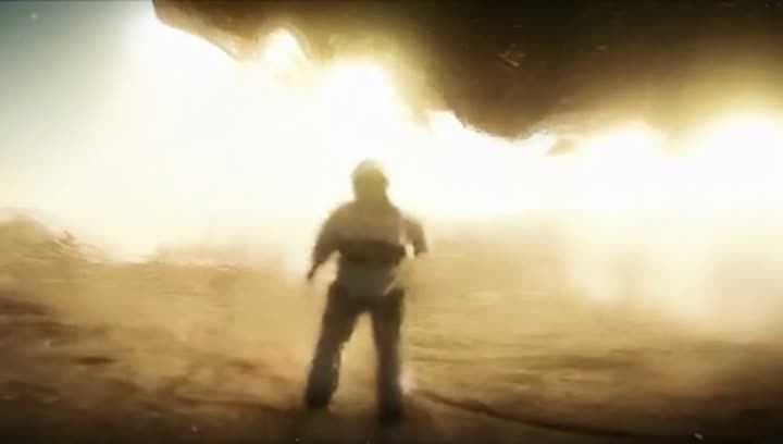 A man walking into a bright dust storm