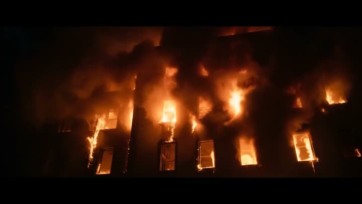 A building on fire at night